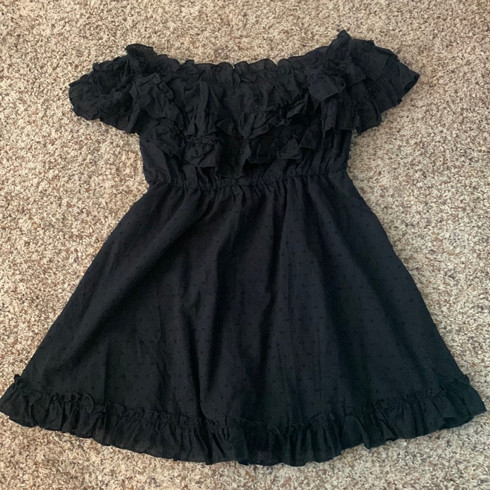 Black off the shoulder dress with ruffle detail